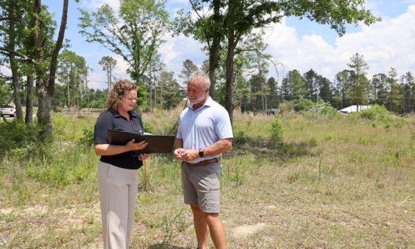 Amy and Mayor Bennett meet at the site in May 2025. Construction has not yet begun