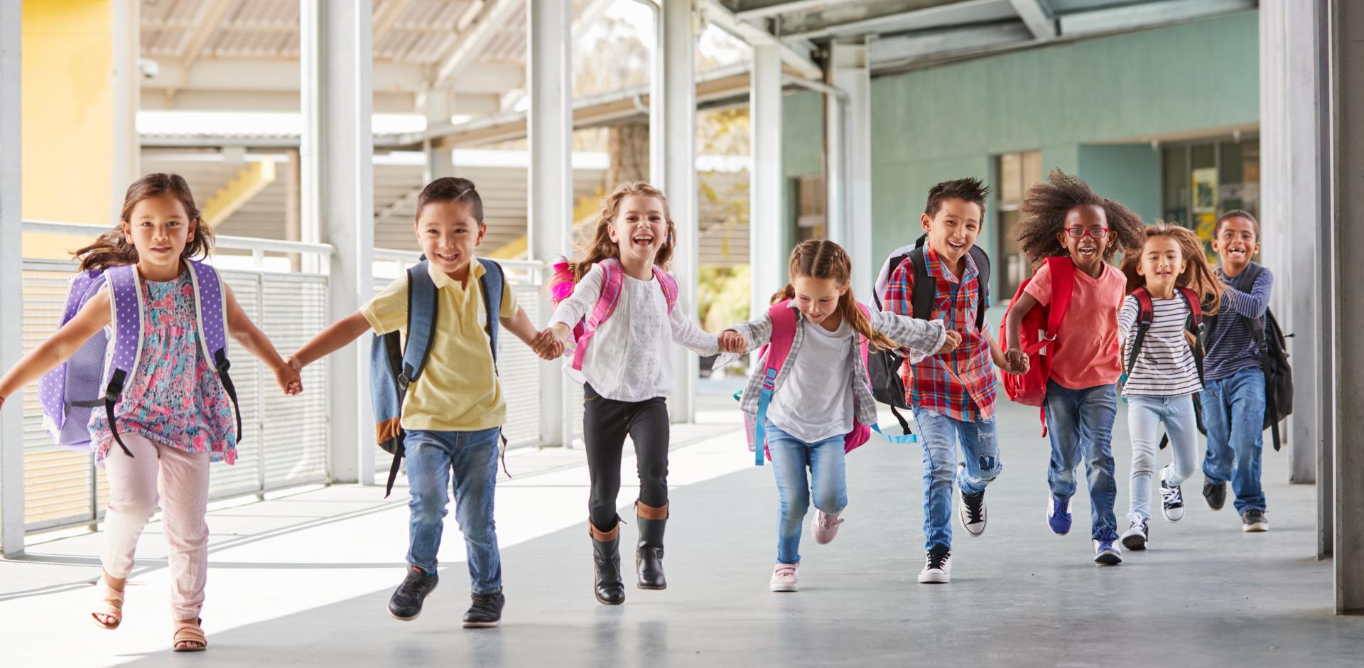 Children lined up in a school hallway